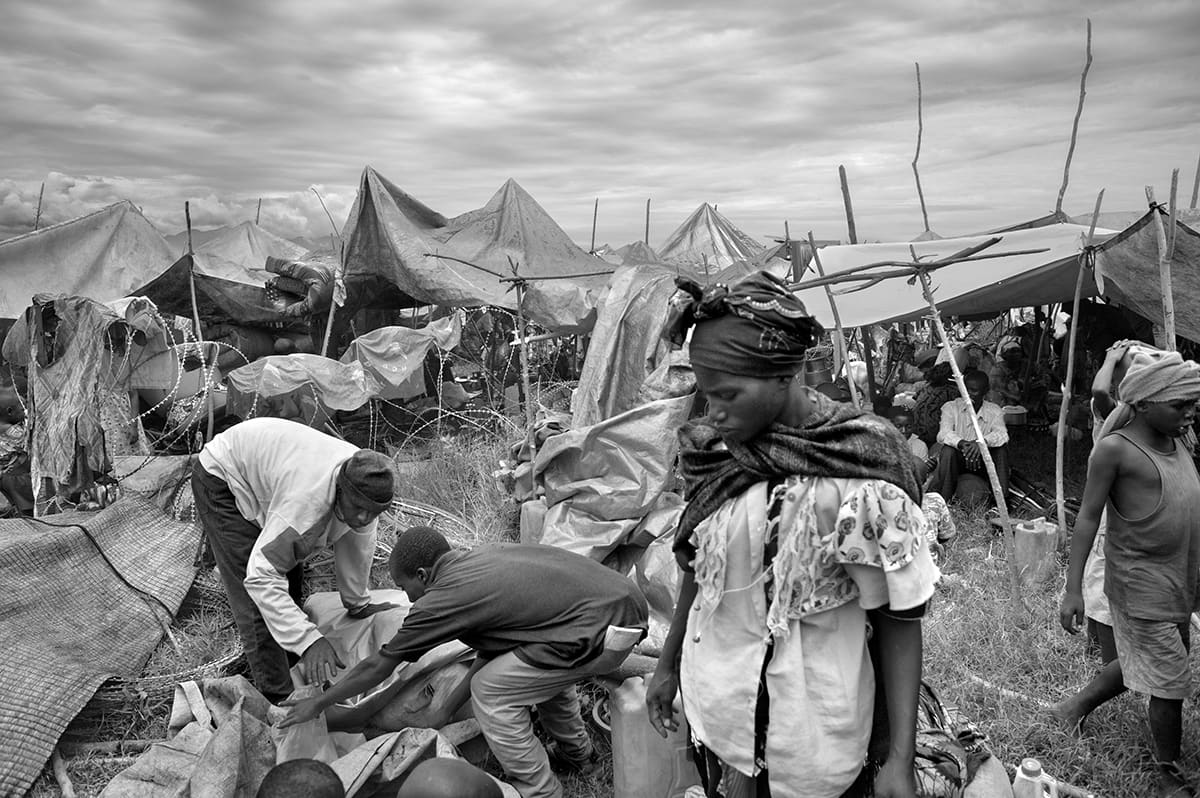 Displaced families sheltering in the Kiwanja camp beside the MONUC United Nations base.