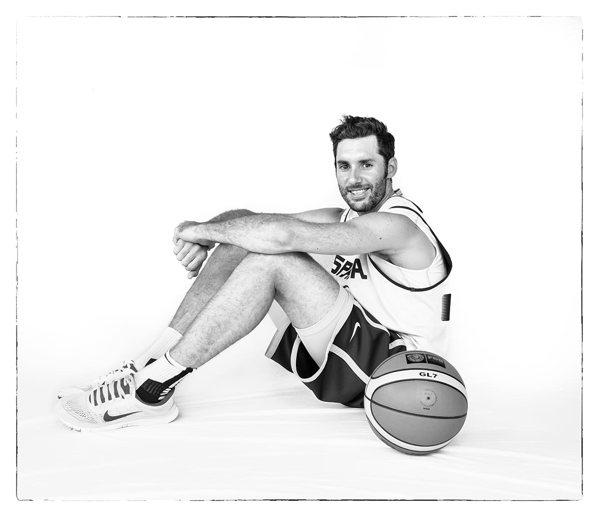 Black and white studio portrait of Rudy Fernández, basketball player, from the series Ñ by Álvaro Ybarra Zavala.