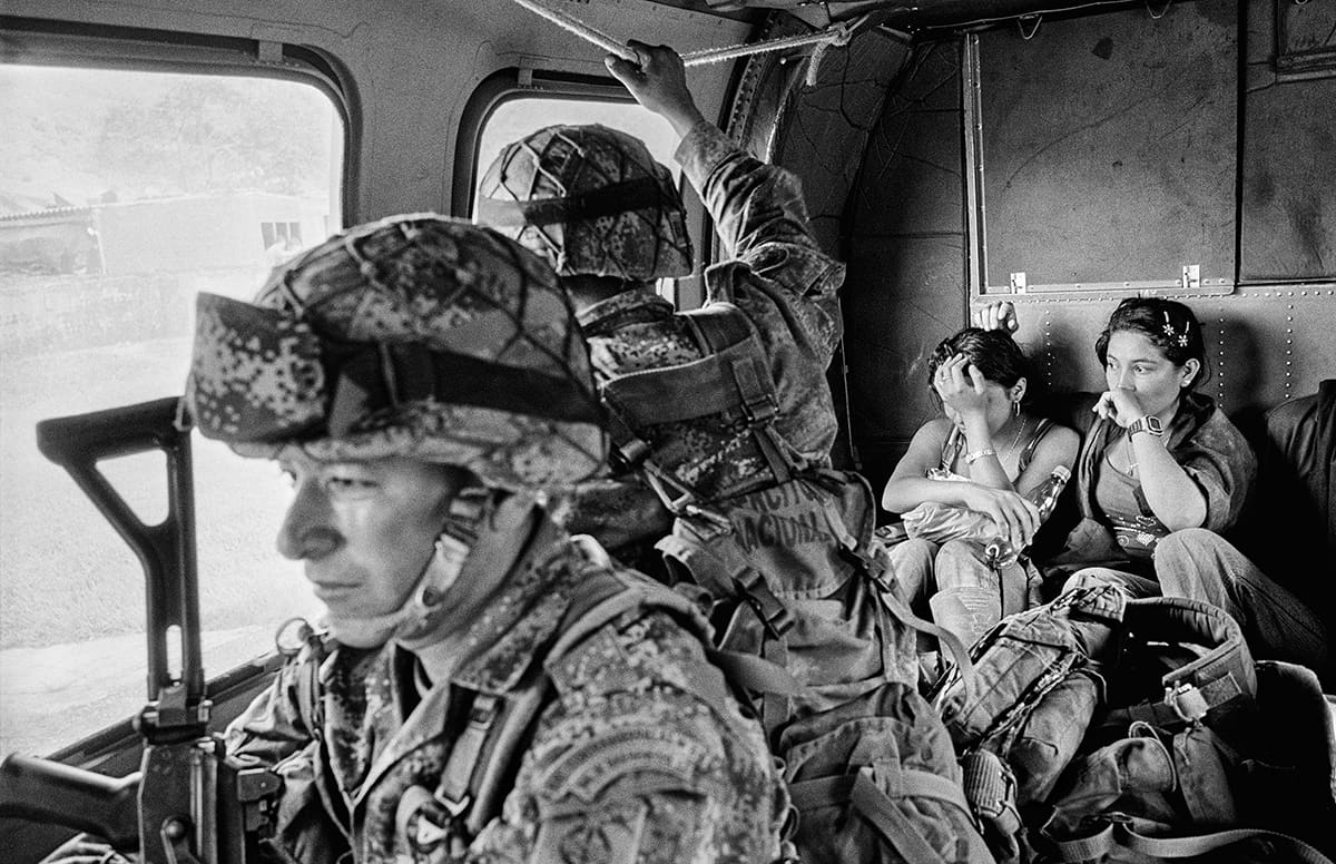 Colombian Army soldiers escort captured FARC guerrillas after a counter-insurgency operation in Tolima, 2011