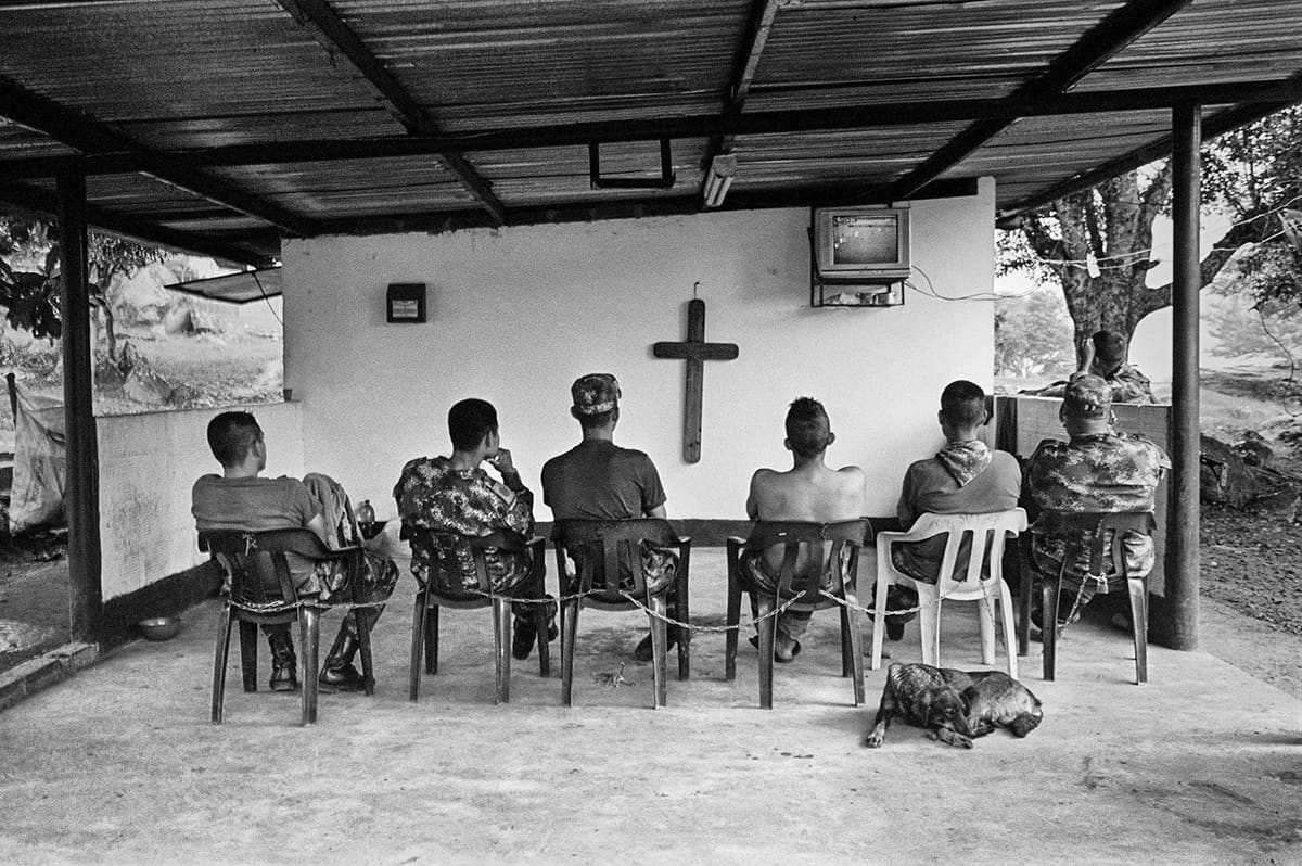 Colombian soldiers watch a football match during a rest from counter-guerrilla operations in Huila, 2011