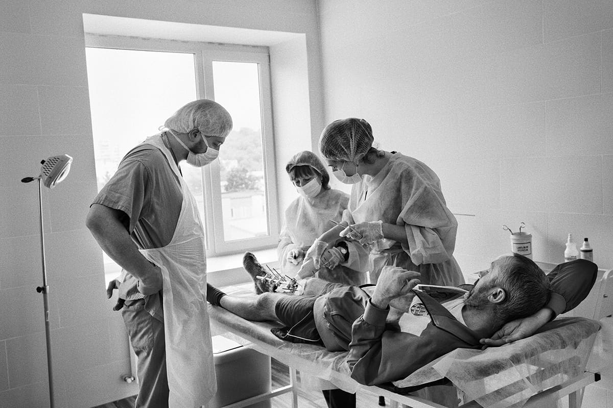 Doctor Danylo Turkevych visits one of his patients during post-operative care at Saint Panteleimon hospital in Lviv.
