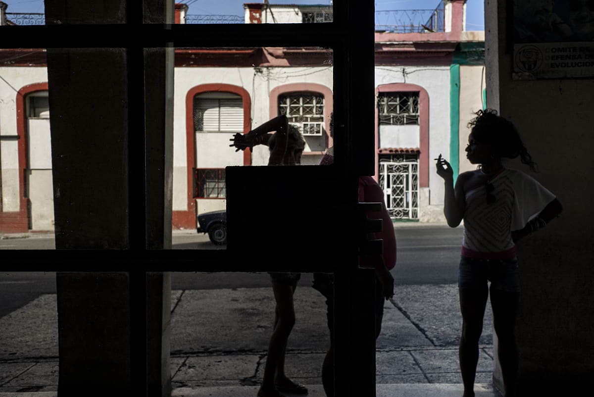 A group of trans women taking a break in the street after an HIV prevention course in Havana.