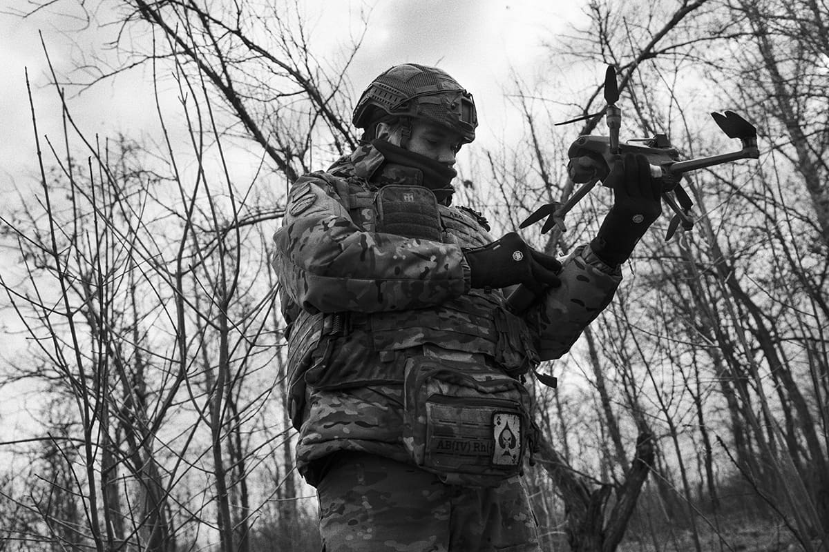 A Ukrainian soldier prepares a kamikaze drone during an operation against Russian troops in Pokrovsk.