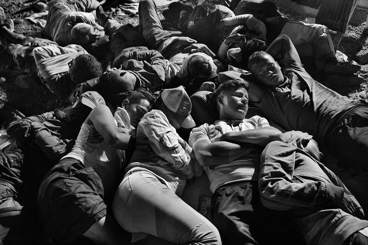 Venezuelan migrants sleep outdoors in an open field in Cúcuta after crossing the border