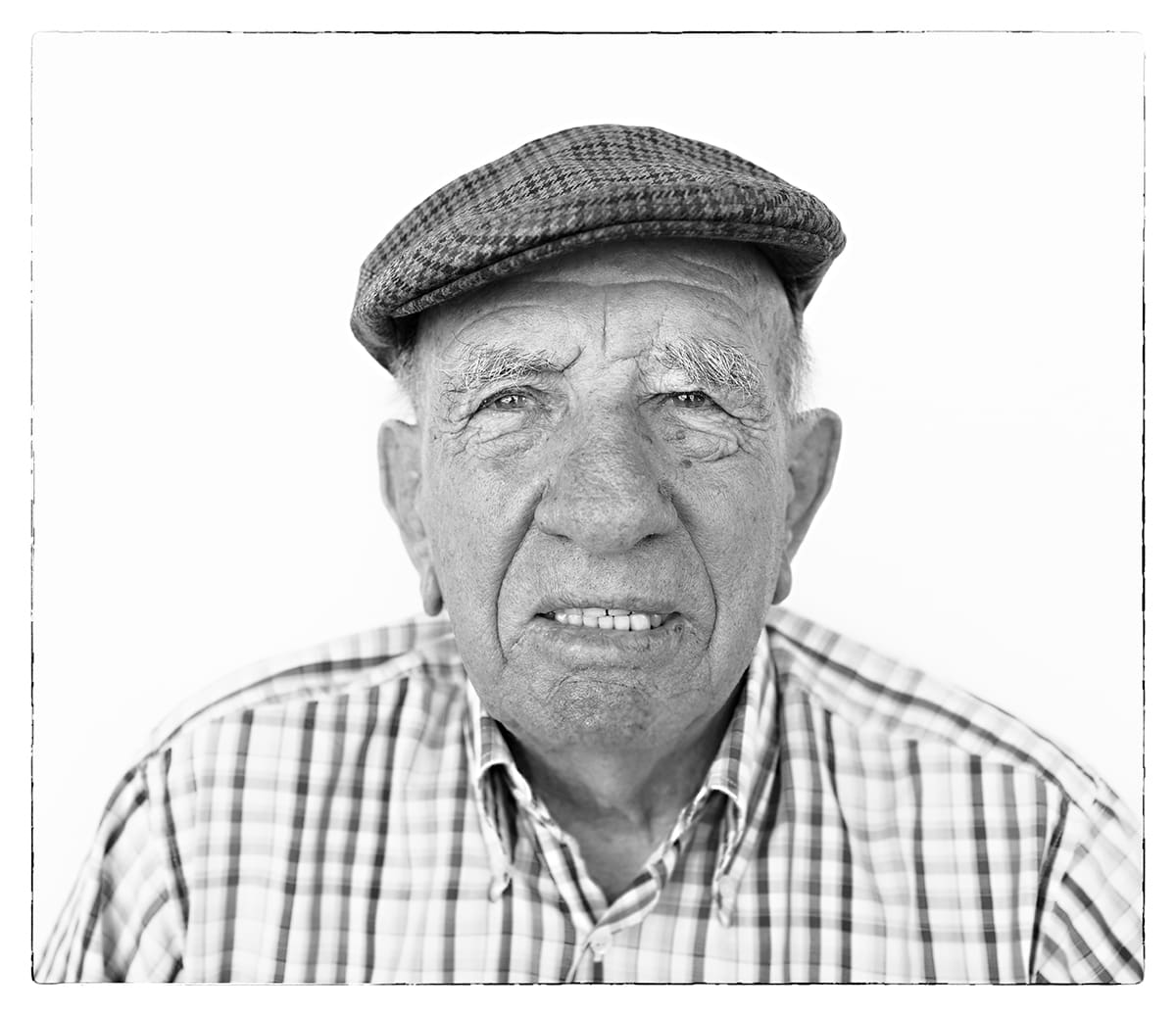 Black and white studio portrait of Victorino Martín Andrés, bull breeder, from the series Ñ by Álvaro Ybarra Zavala.