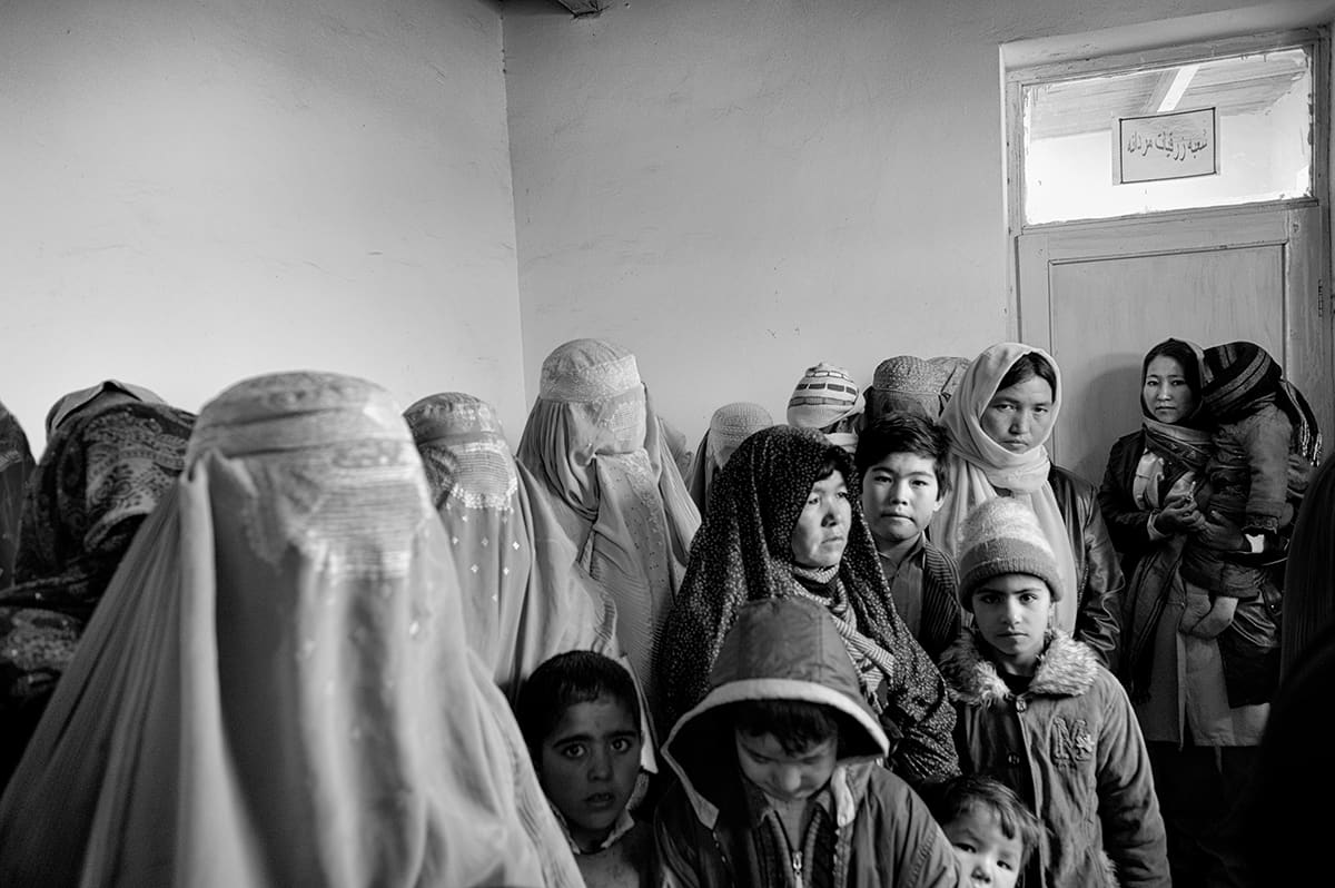 Afghan women and children waiting in line at the Institute for Malaria and Leishmaniasis in Kabul, February 2009