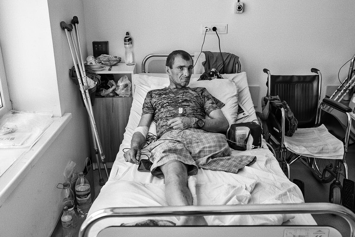A Ukrainian soldier who lost his leg to a war wound recovers at Saint Panteleimon hospital in Lviv.