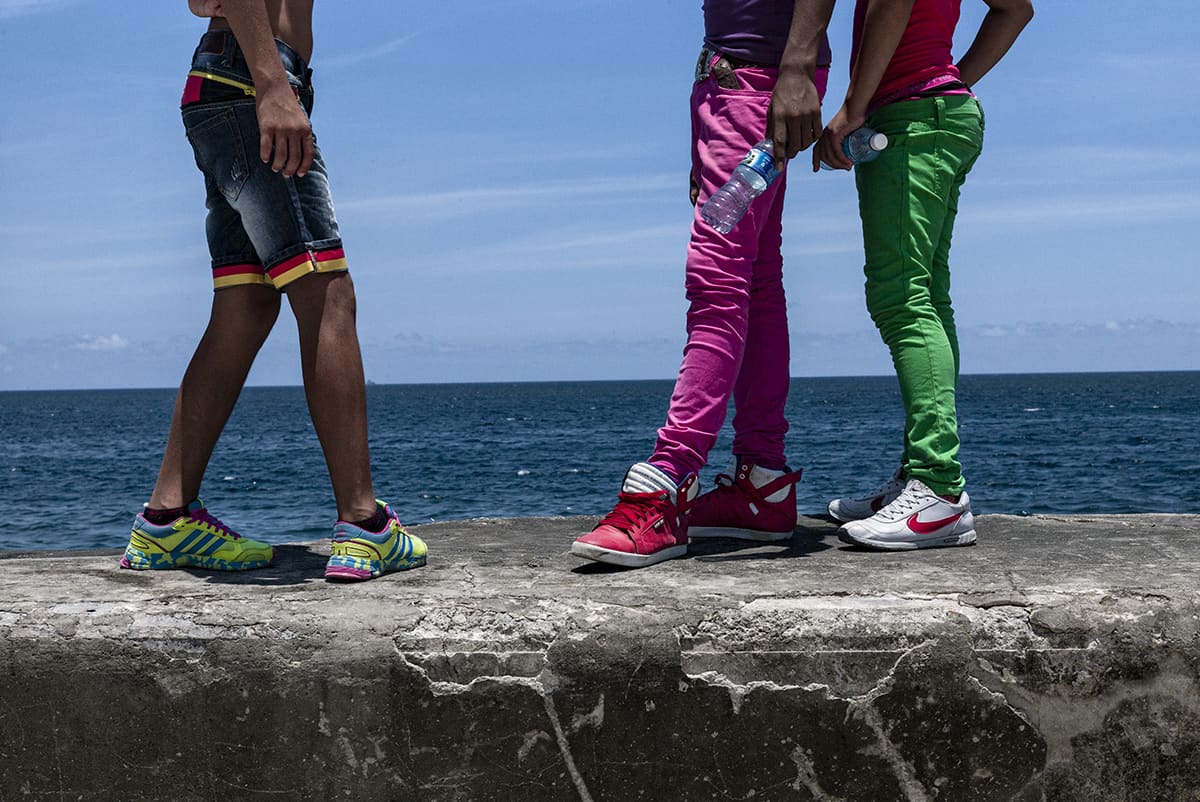 A group of young gay men on the Malecón seafront in Havana, Cuba.
